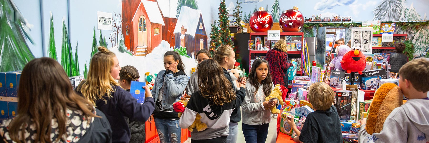 Group of kids picking out toys at the Winter Wonderland Event